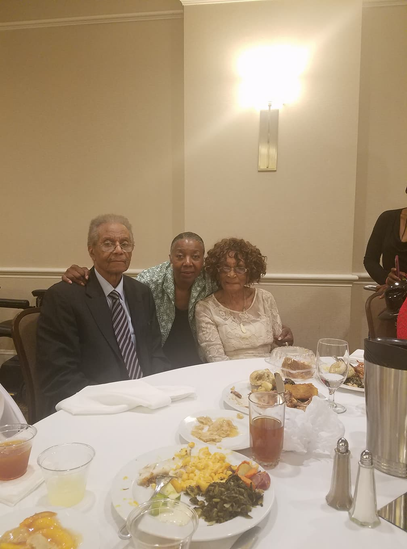 Three family members sharing a meal at the reunion banquet