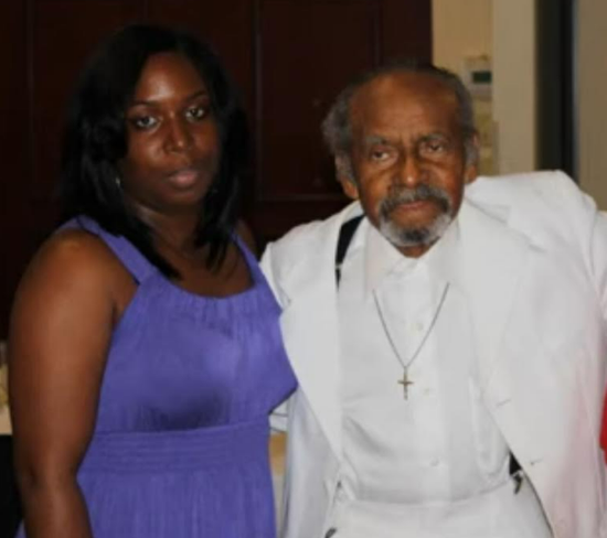 Two family members posing together at a reunion event
