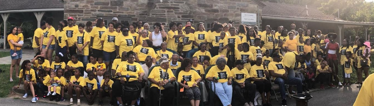 Massive Brooks-Wineglass family group photo in yellow shirts outdoors