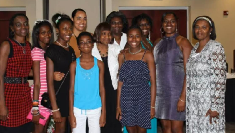 Women and girls group photo at a reunion gathering