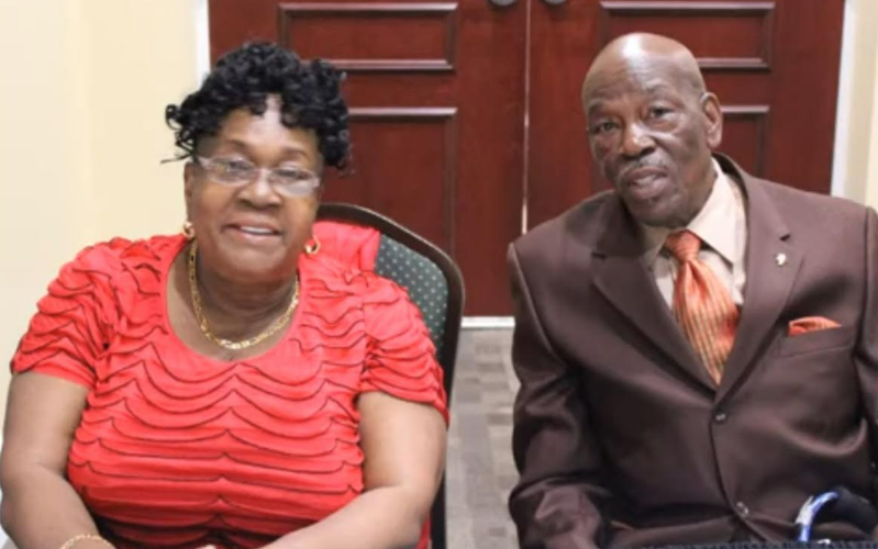 Elder couple seated together at a reunion event