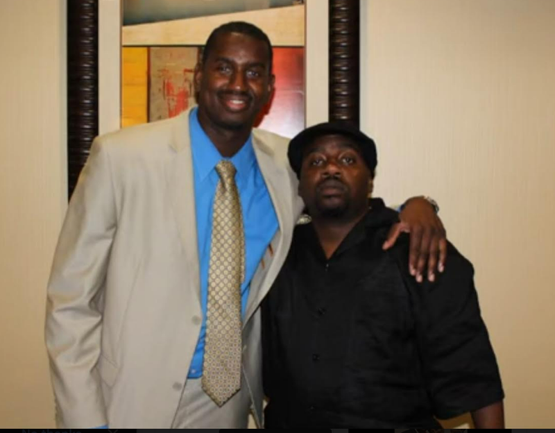 Two cousins posing together at a reunion event