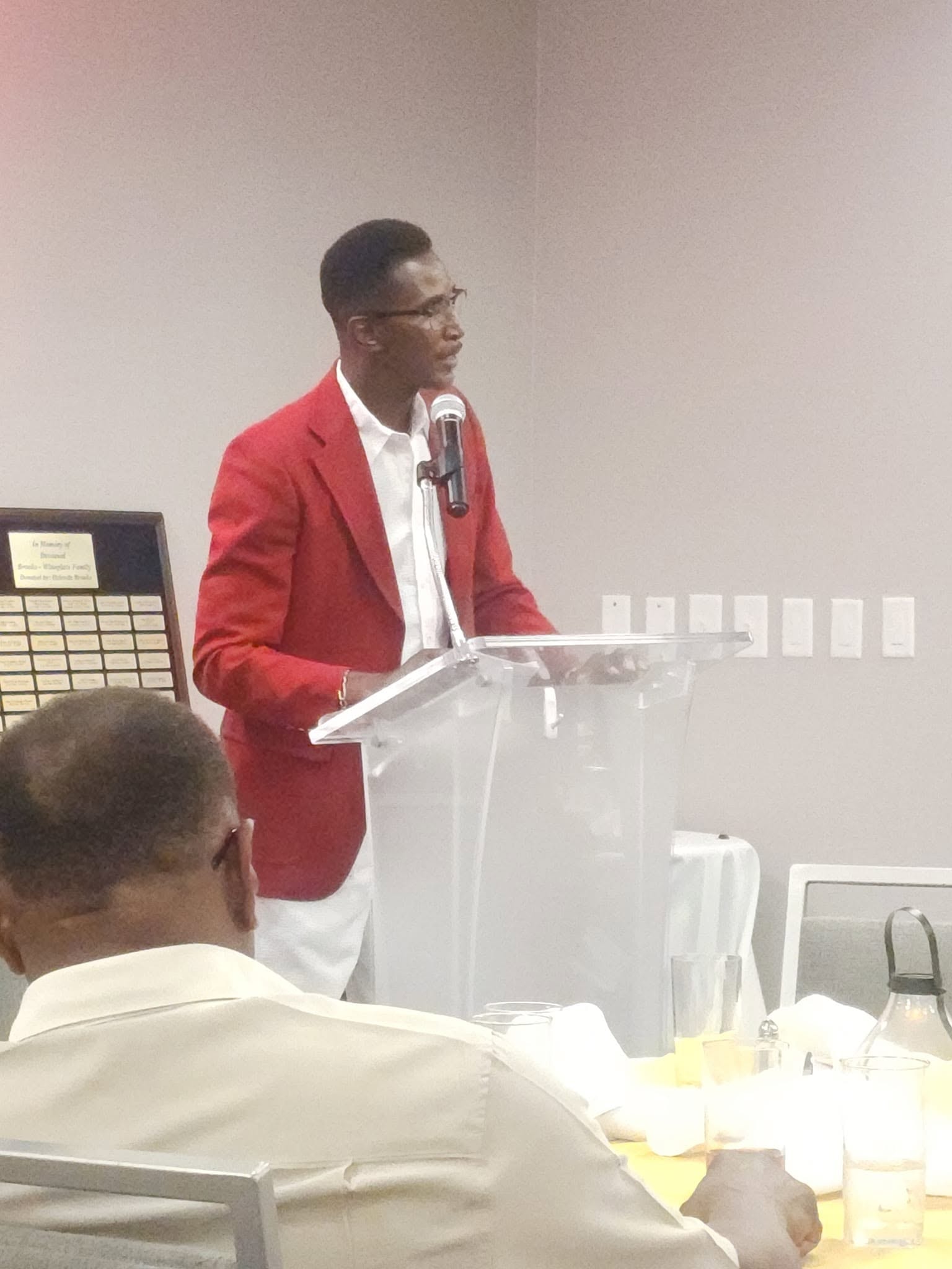Family member speaking at the podium during the reunion program