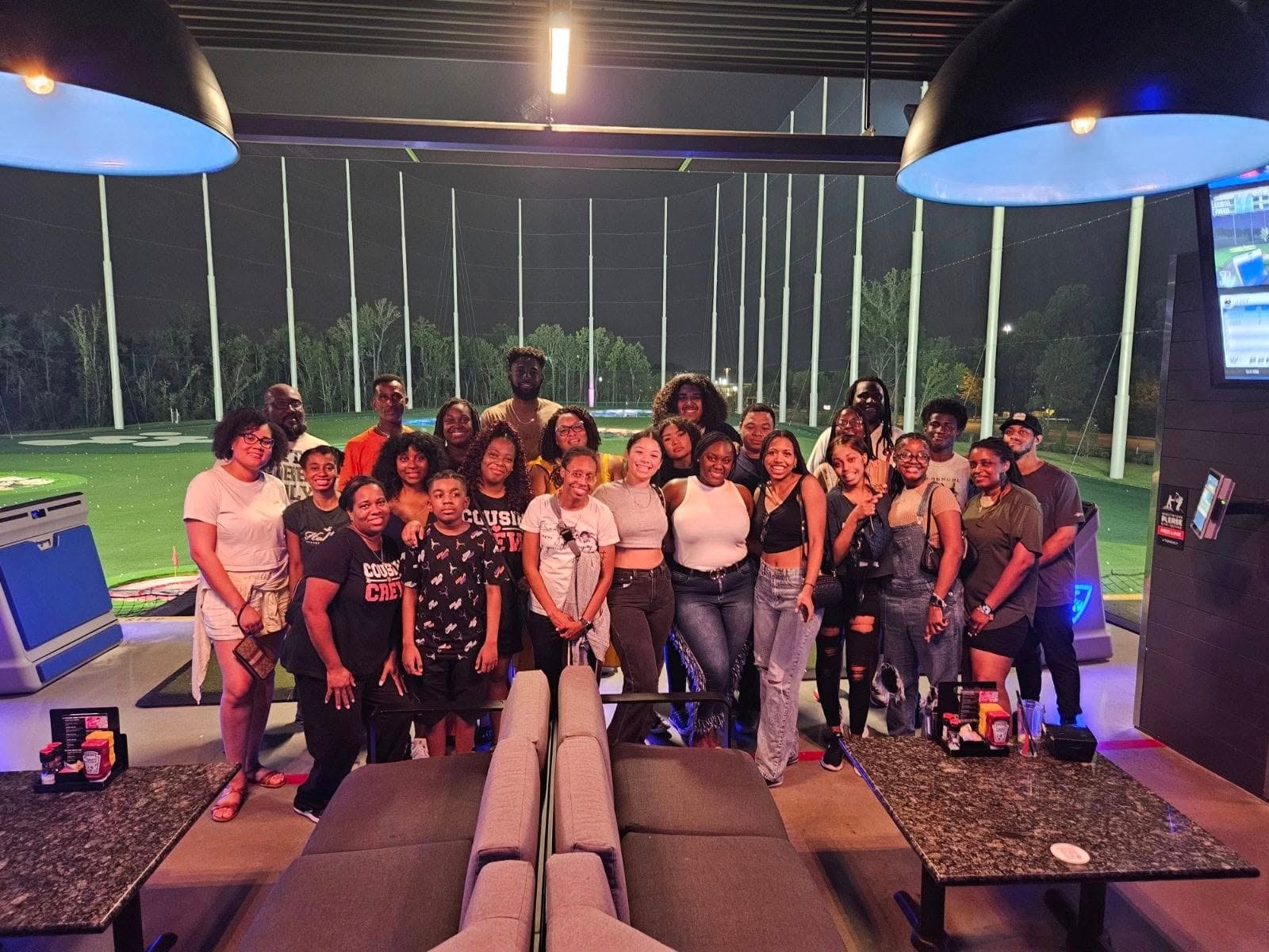 Cousin Crew group photo at Top Golf during the reunion