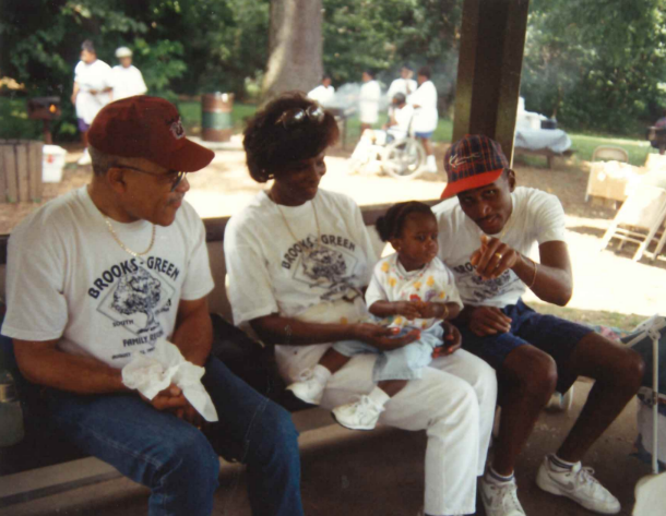 Family members sitting together at the reunion picnic