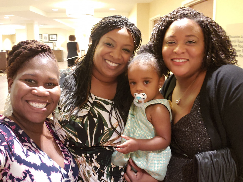 Family members smiling together at a reunion event